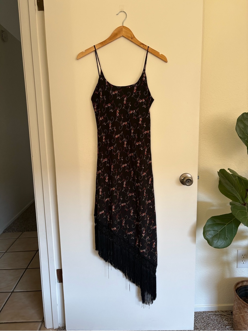 Black midi dress with floral embroidery and fringe detail